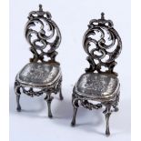 A pair of miniature Dutch silver chairs with import hallmarks for London 1896, 6cm tall
