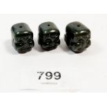 A set of three Japanese carved black onyx ojime beads