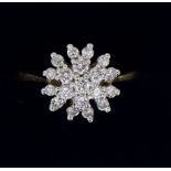 An 18 carat gold diamond cluster ring, size N-O, 3.7g