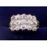 An 18 carat gold Georgian style diamond ring set fifteen old cut diamonds in three rows, size M,