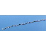 An 18 carat white gold AA tanzanite and diamond set bracelet,