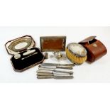 A group of silver items including pair of gentleman's brushes, tea knives, photograph frame etc.