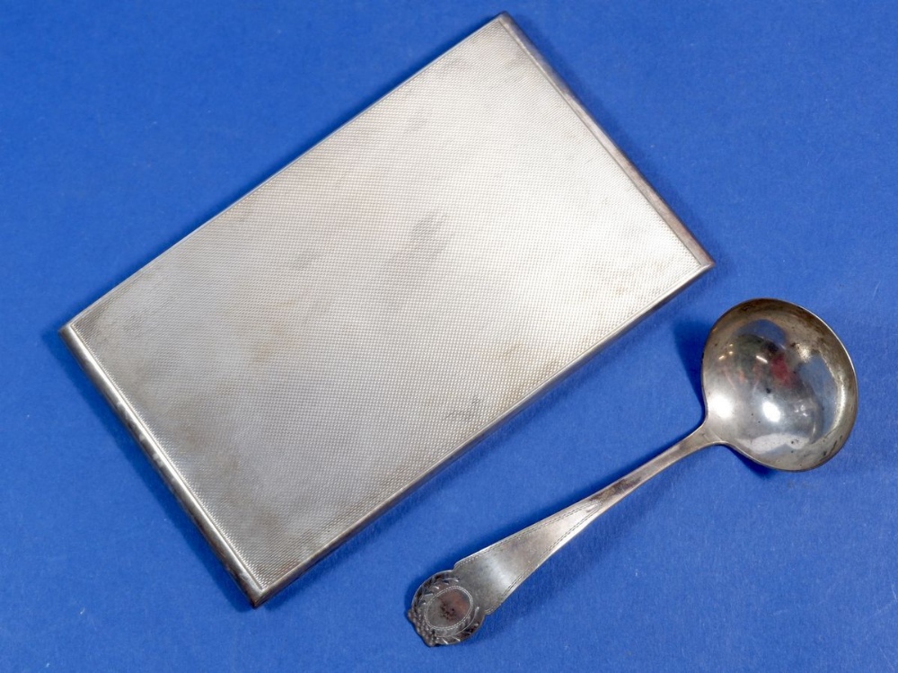 A silver cigarette case, 240g and a continental silver sugar spoon