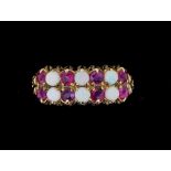 A 9 carat gold ring set two rows of opals and amethysts, size M-N, 1.9g