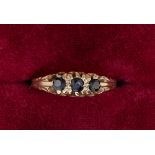 A 9 carat gold three stone sapphire ring , size M-N