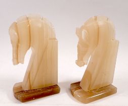 A pair of marble Art Deco style horse head bookends, 19cm tall