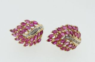 A pair of vintage style 14 carat ruby and diamond set leaf form earrings, 7.8g