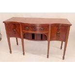 A reproduction mahogany serpentine sideboard on square supports and spade feet, 153 x 60 x 95cm