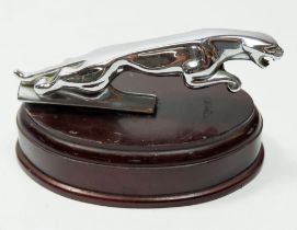 A vintage Jaguar chrome car bonnet mascot mounted on wooden base, 12.5cm long