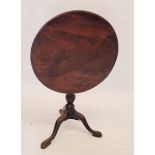 A Georgian mahogany circular tilt top occasional table on triple supports