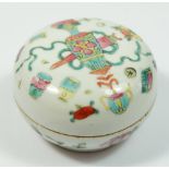 A mid to late Qing dynasty floral painted circular ink box, 9cm