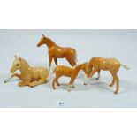 A group of four Beswick Palamino foals