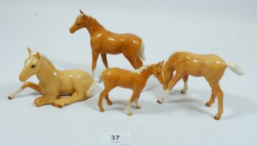 A group of four Beswick Palamino foals