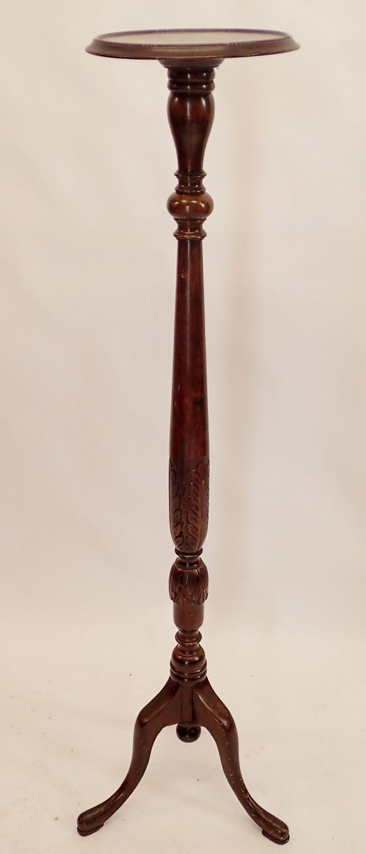 A mahogany carved tall torchere stand 141cm tall