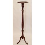 A mahogany carved tall torchere stand 141cm tall