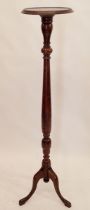 A mahogany carved tall torchere stand 141cm tall