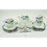 A German Art Deco style tea service comprising: teapot, sugar and milk with four cups and saucers