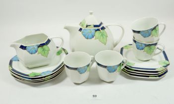 A German Art Deco style tea service comprising: teapot, sugar and milk with four cups and saucers