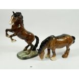 A Beswick rearing horse and a shire horse