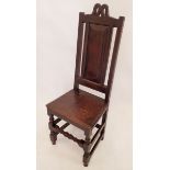 A 17th century provincial panel back chair with solid seat and turned supports