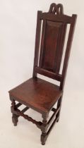 A 17th century provincial panel back chair with solid seat and turned supports