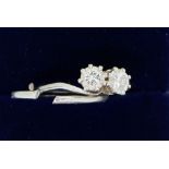 A white metal ring crossover set two diamonds - a/f, band a/f total weight 4.6g