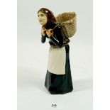 A Coll pottery figure of a women, Isle of Lewis, 19cm tall