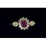 A gold ring (unmarked) set ruby and diamond cluster, size N to O