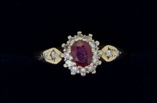 A gold ring (unmarked) set ruby and diamond cluster, size N to O