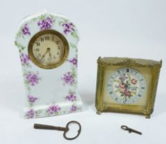 A vintage gilt and embroidered boudoir clock and an Edwardian floral porcelain clock, 18cm tall