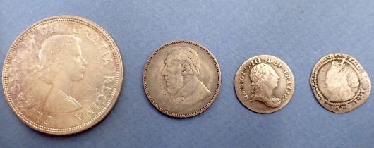 Four miscellaneous silver content coins including: South Africa shilling 1896, George III threepence