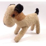 An early 20th century soft toy terrier dog, 23cm long