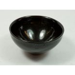 A Chinese 20th century Jian Ware style glazed bowl with lustred spots to the brown black glaze, 12.