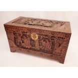 A Chinese camphorwood chest with carved decoration, 105cm wide