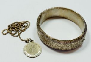 A silver bangle and a silver pendant, chain a/f