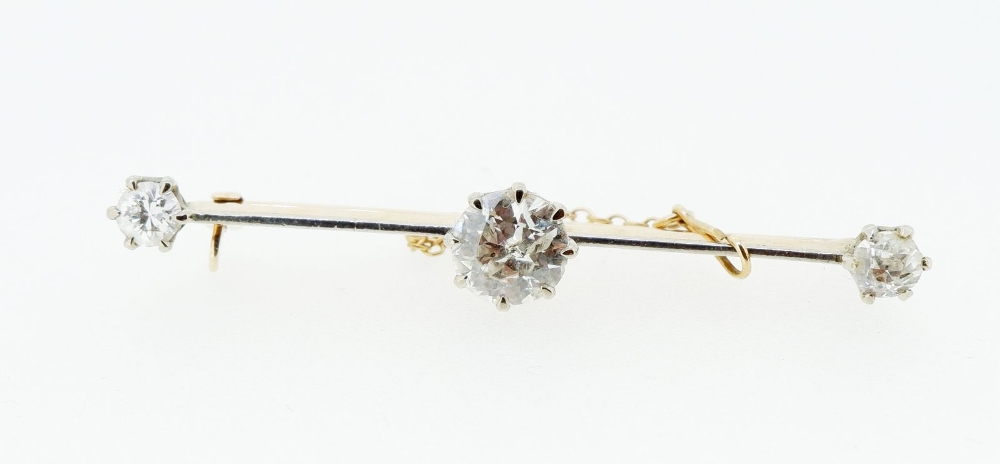 An 18 carat and platinum gold bar brooch set central diamond (1.48cts) flanked by two further - Image 3 of 5