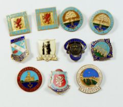 A group of Masonic enamel bowling badges and a British Legion badge