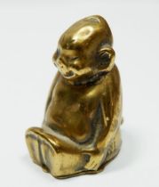 A brass novelty vesta in the form of a imp