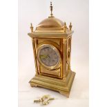 A 19th century Benson's gilt metal architectural style mantel clock with panelled case flanked by