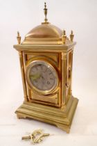 A 19th century Benson's gilt metal architectural style mantel clock with panelled case flanked by