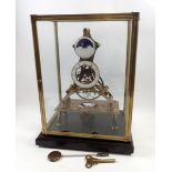 An eight day skeleton clock with fusee movement and enamelled dials, including moonphase dial,