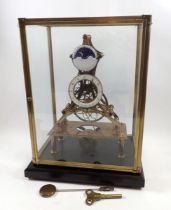 An eight day skeleton clock with fusee movement and enamelled dials, including moonphase dial,