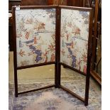 A 19th century mahogany two fold fire screen with chinoiserie printed fabric