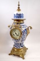 A 19th century French blue and white porcelain clock with gilt metal mounts, 49cm tall