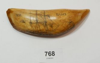 A whales tooth scrimshaw with eagle and sailing ship decoration, 14cm