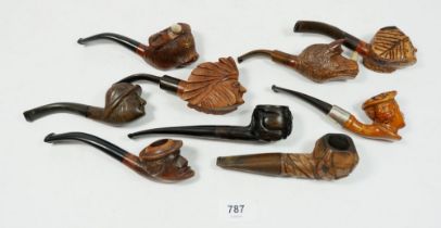 A collection of nine character and novelty smoking pipes to include a rhinoceros head example