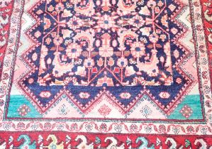 A blue ground Persian Sarouk runner with all over design 312x134cm
