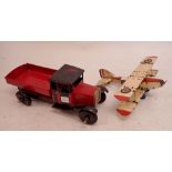 A painted metal toy truck, 49cm and a painted model metal aeroplane, 47cm wingspan