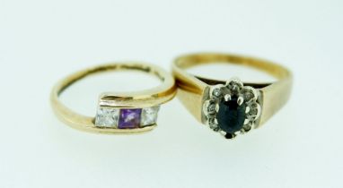 A 9 carat crossover ring set amethyst and white stones, size H and a 9 carat gold sapphire cluster