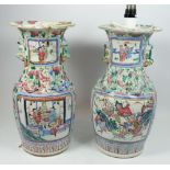 A pair of Chinese Tongzhi period Canton vases painted reserves of dignitaries and warriors with Fo